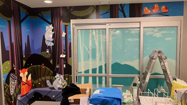 A wall mural of cartoon forest animals in BC Children's Hospital.